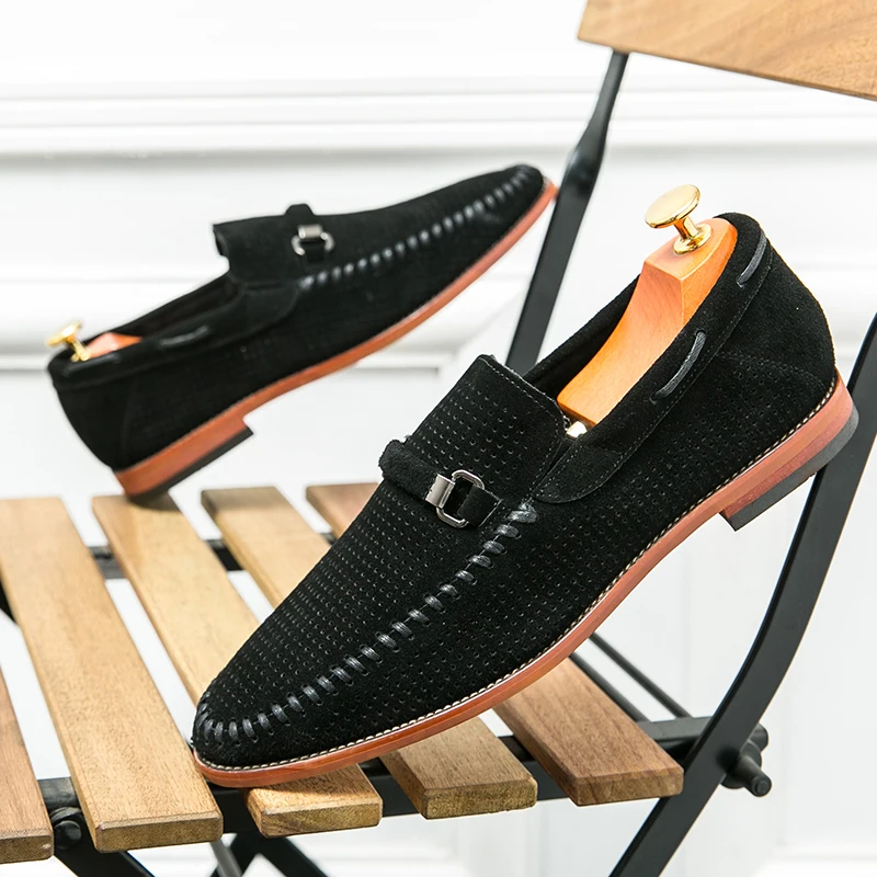 Stylish men's black perforated loafers, comfortable and easy to slip on.