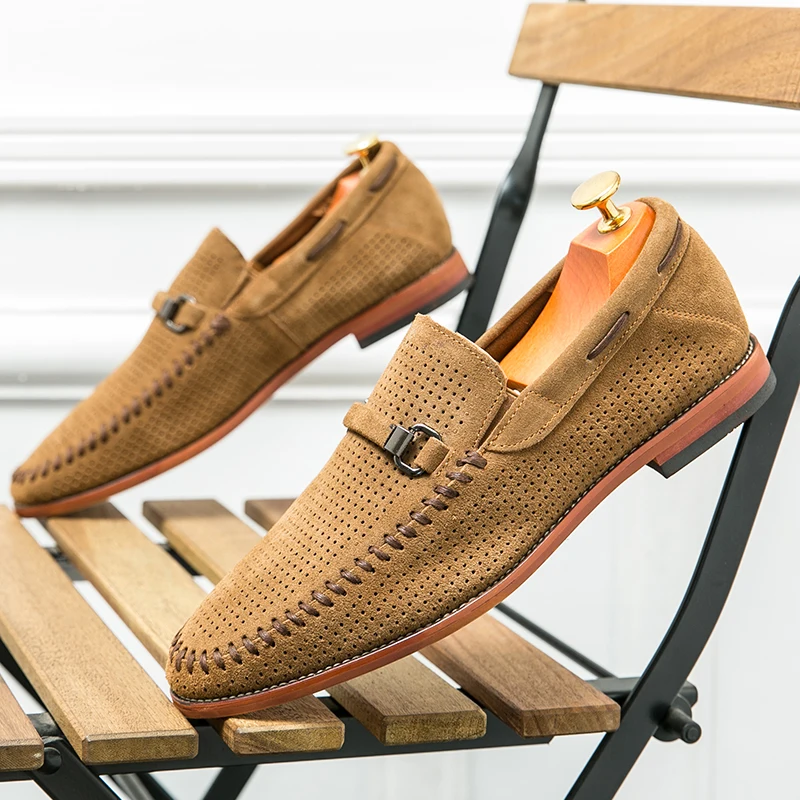 Casual navy slip-on loafers for men, featuring perforated design for foot comfort.