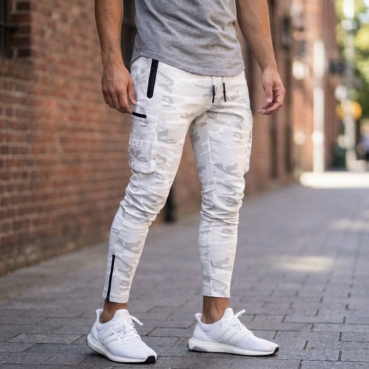 Men's black performance jogging trousers with secure zip pockets, ideal for gym, training & activewear.
