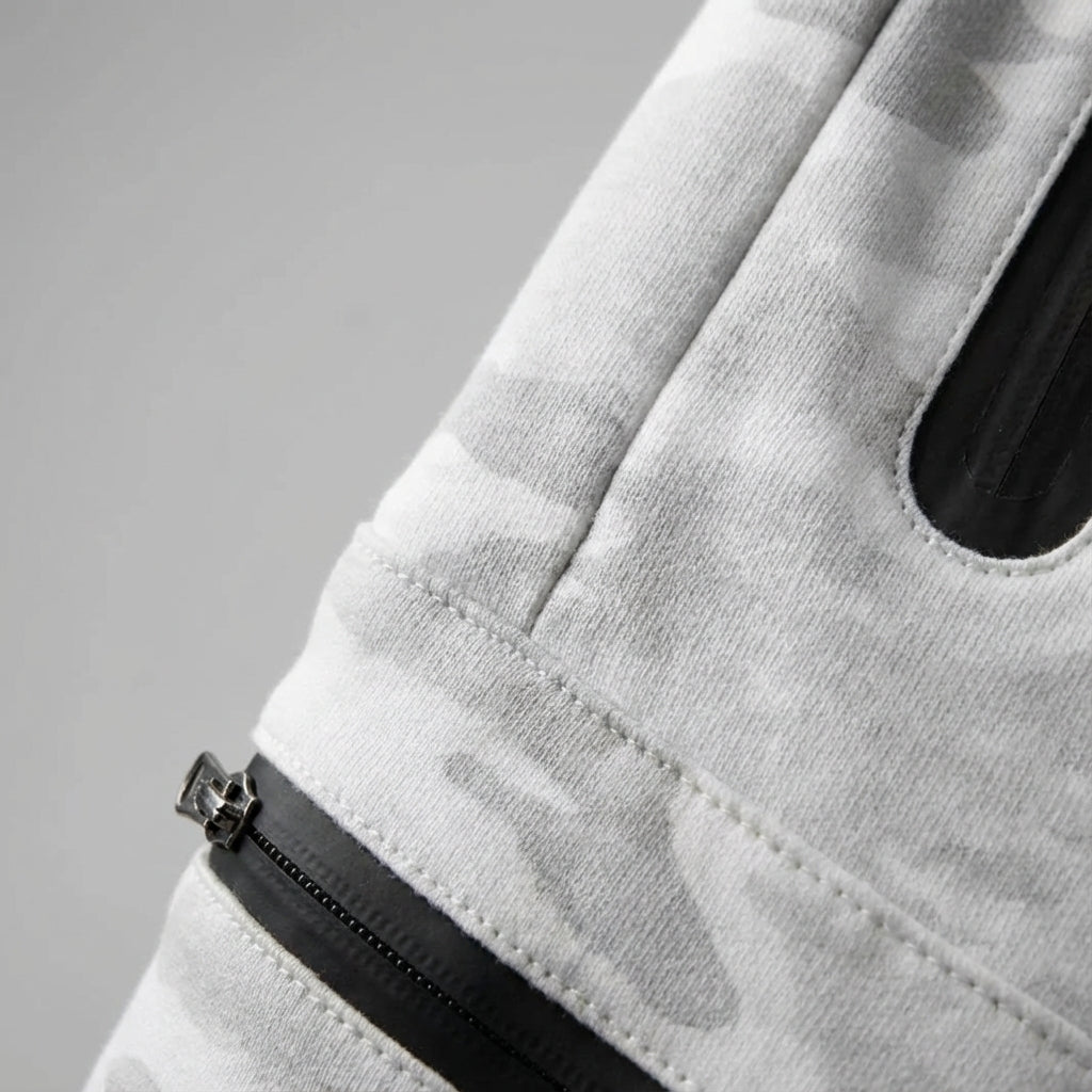 Comfortable men's activewear joggers. Tapered casual trousers with practical zip pockets for training.