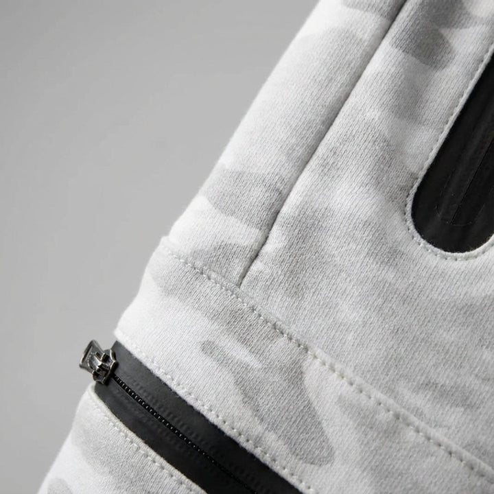 Comfortable men's activewear joggers. Tapered casual trousers with practical zip pockets for training.