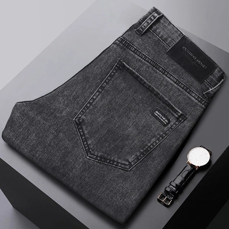 Close-up of the black straight-leg men's denim jeans fabric, highlighting the cotton stretch texture.