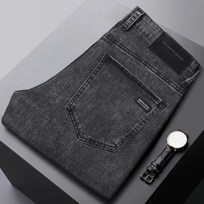 Close-up of the black straight-leg men's denim jeans fabric, highlighting the cotton stretch texture.