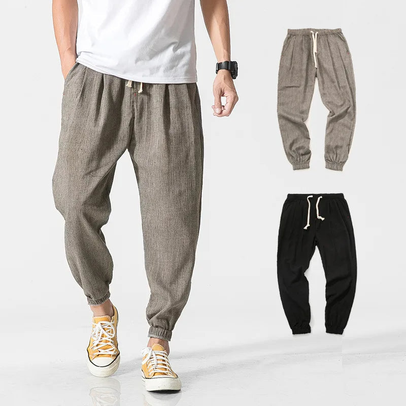 Men's black relaxed fit tapered joggers for ultimate comfort & casual style.
