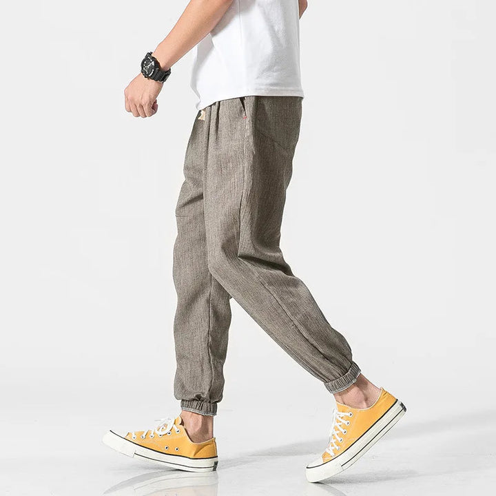 Comfortable men's relaxed fit tapered joggers with elastic waist, ideal for athletic or loungewear.