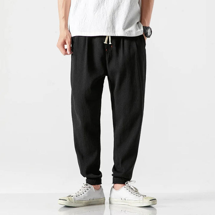 Stylish charcoal grey men's relaxed fit tapered joggers, ideal for comfort, loungewear & street style.