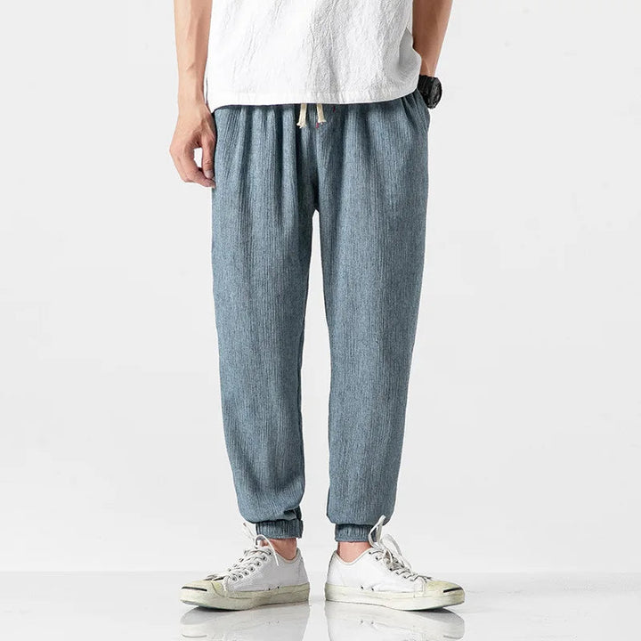 Tapered leg detail on men's comfortable relaxed fit joggers, perfect for a modern casual look.