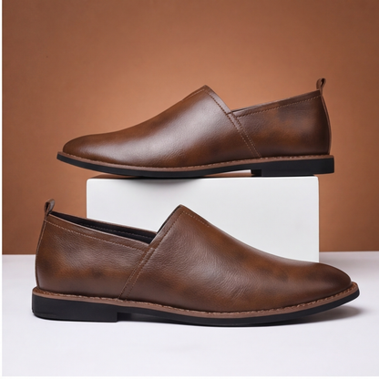 Classic men's brown leather dress loafers, perfect for office or smart casual outfits.