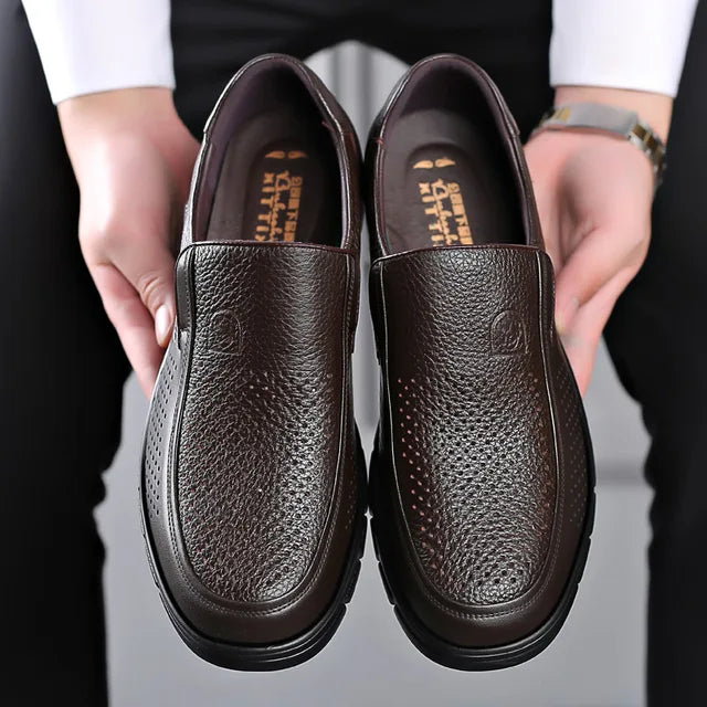 Man wearing men's everyday comfort slip-on loafers, demonstrating easy style & casual fashion.