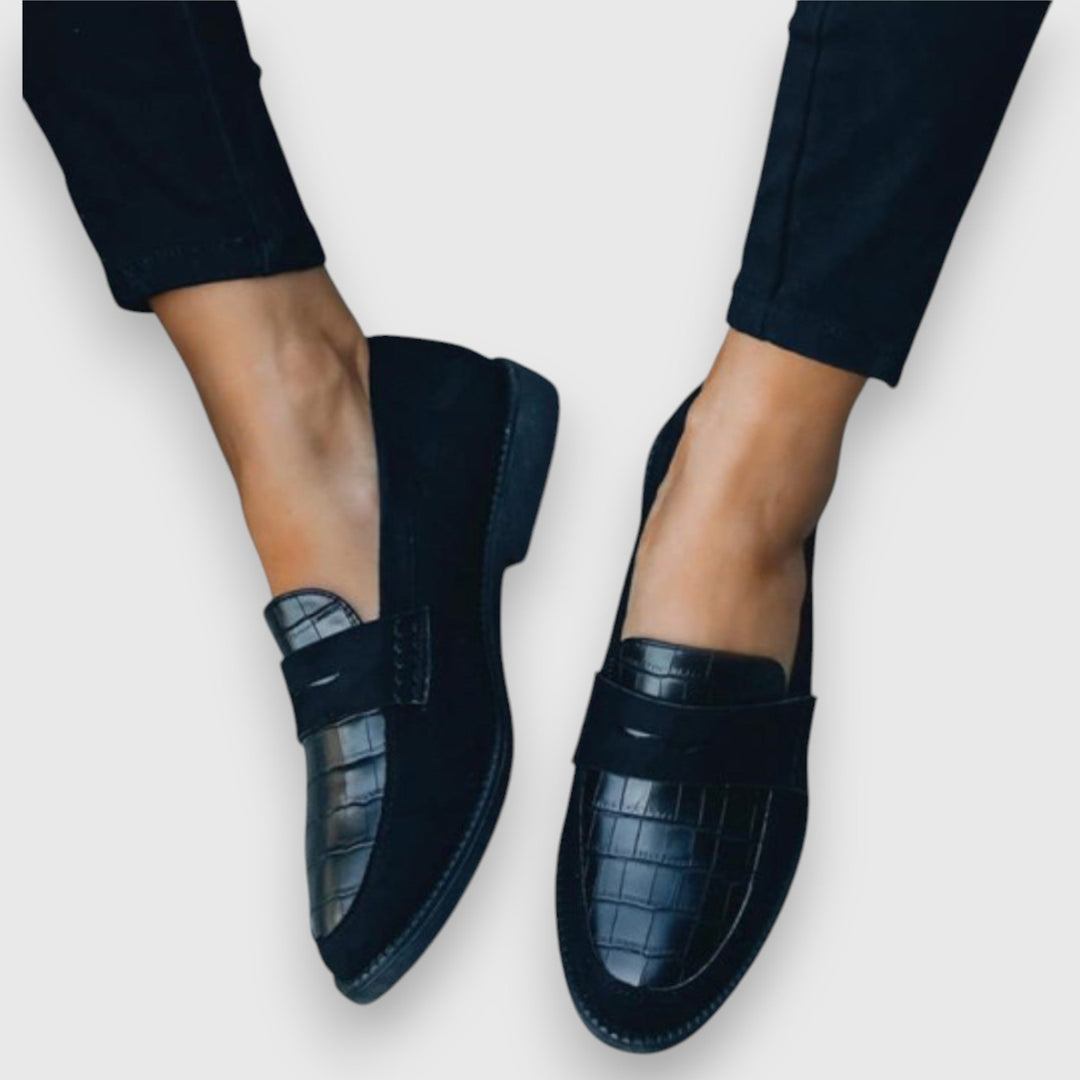 Men's black slip-on loafers with ergonomic comfort fit, perfect for casual or business casual wear.