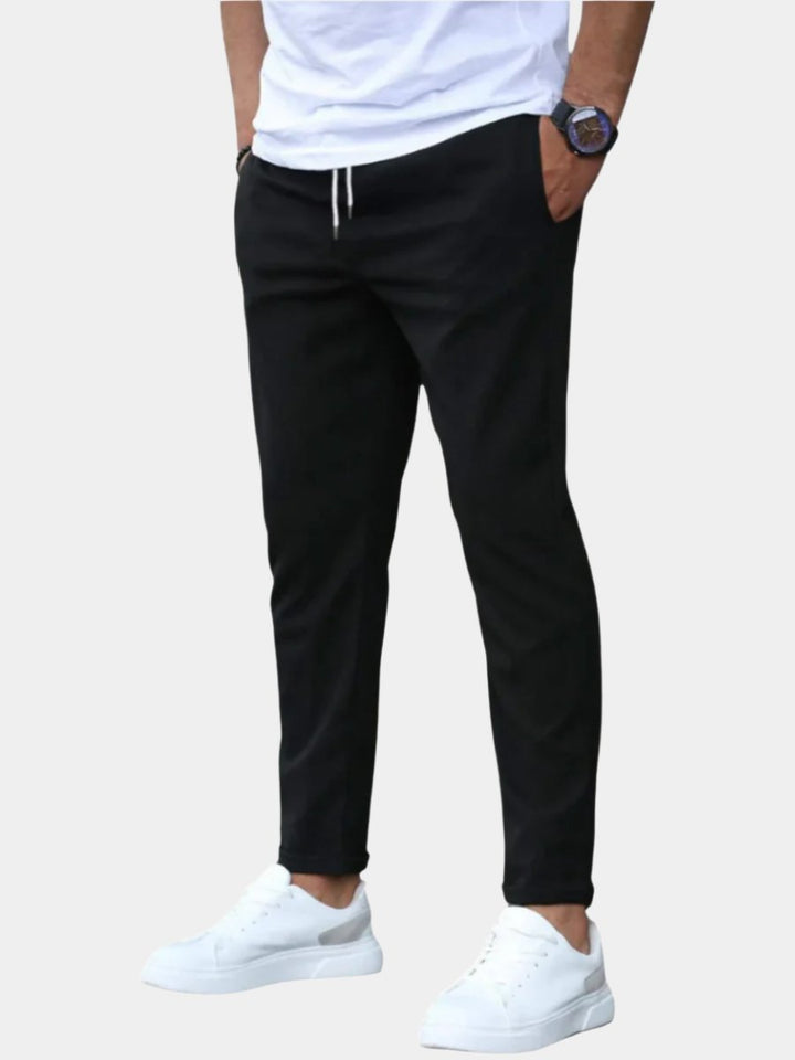 Men's black stretch drawstring chino pants, slim fit for ultimate comfort & modern casual style.