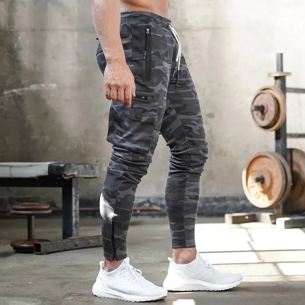 Black men's activewear cargo pants, tapered fit, ideal for gym, running & training.
