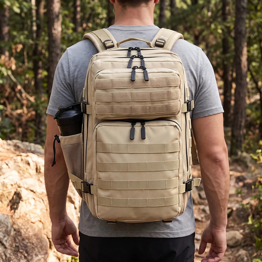 Men's black tactical hiking backpack with MOLLE system for outdoor adventures & camping gear. Durable travel pack.