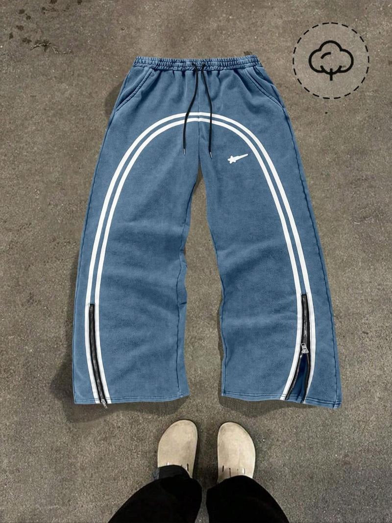 Stylish men's tapered fit track pants, black color, featuring practical zip hems for streetwear & casual wear.