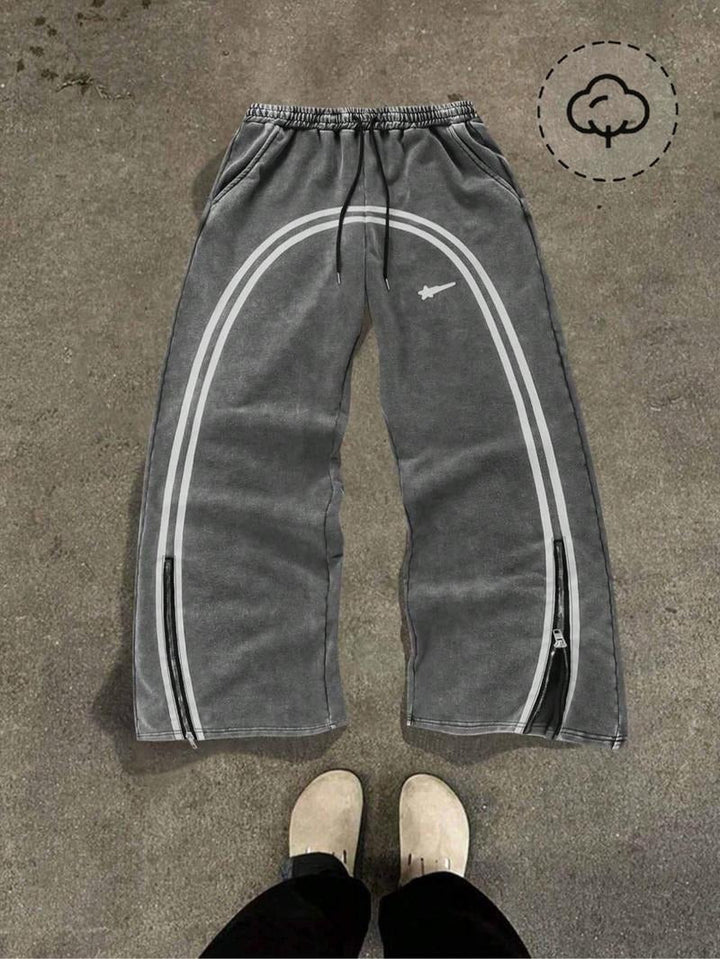 Versatile men's tapered fit track pants, black, with functional zip hems. Great for gym, casual, or streetwear fashion.