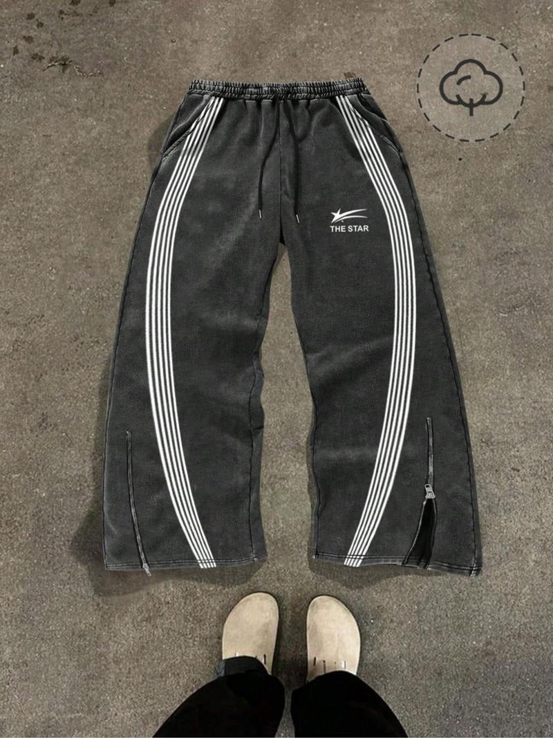 Men's comfortable black tapered joggers featuring stylish zip hems for adjustable fit and modern athletic look.