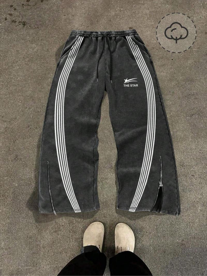 Men's comfortable black tapered joggers featuring stylish zip hems for adjustable fit and modern athletic look.