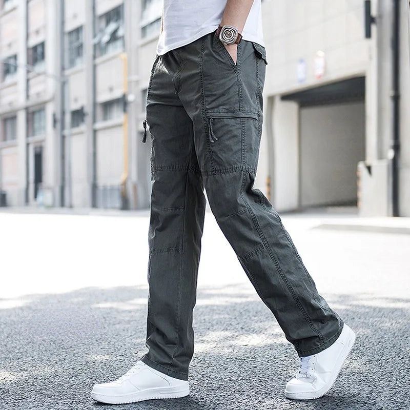 Dark grey men's tech cargo pants, a comfortable fit with multi-pockets for casual and everyday style.