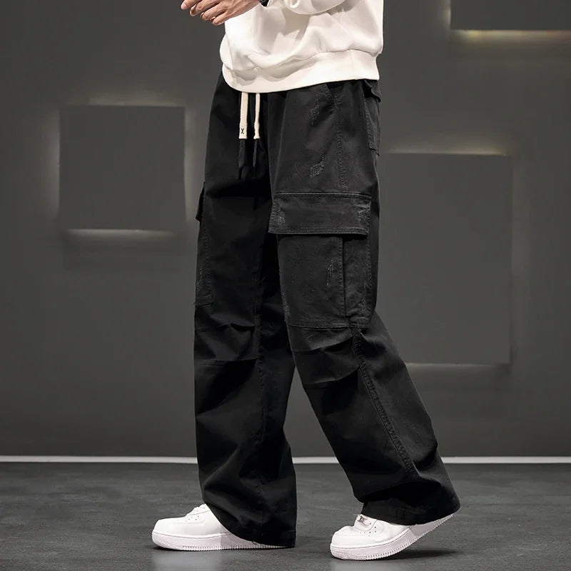 Close-up of large side cargo pockets on functional men's utility pants, ideal for carrying essentials.