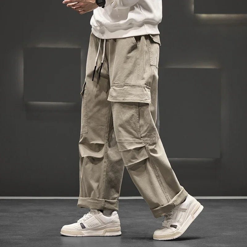 Back view of men's functional cargo pants, showing rear pockets and the comfortable, relaxed silhouette.