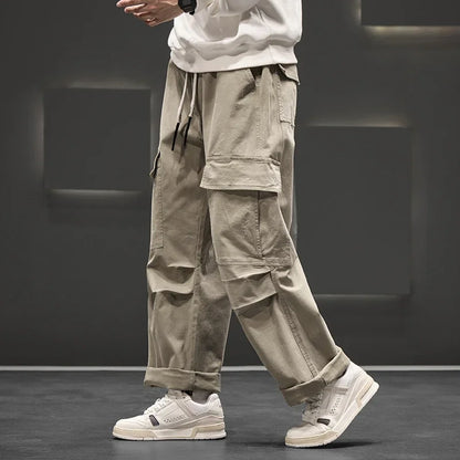 Back view of men's functional cargo pants, showing rear pockets and the comfortable, relaxed silhouette.