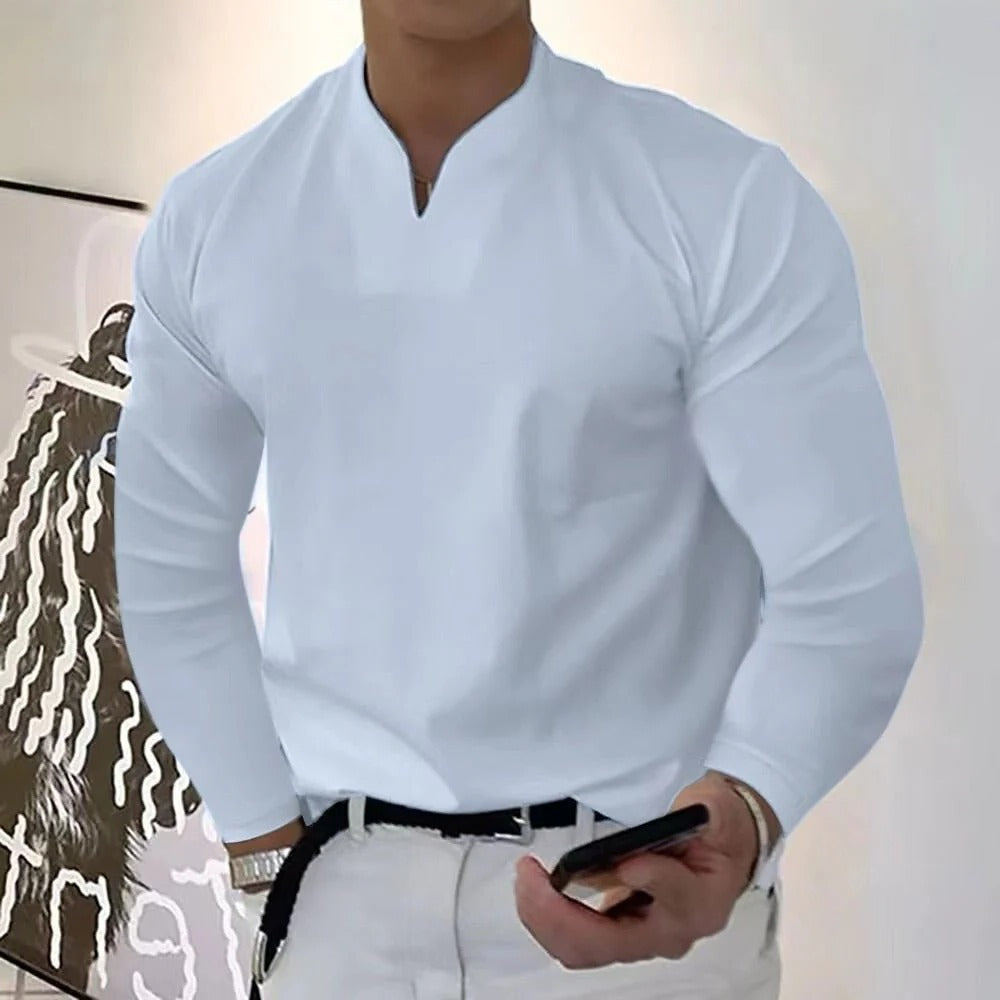 Men's V-neck sweatproof shirt paired with jeans, emphasizing casual comfort, modern everyday style & moisture-wicking.
