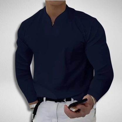 Man wearing stylish gray V-neck sweatproof shirt, ideal casual top for comfort & moisture-wicking everyday style.