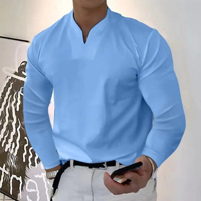 Stack of colorful men's V-neck sweatproof shirts, offering moisture-wicking comfort and versatile everyday style.