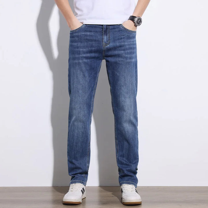 Classic blue men's stretch denim jeans, durable & comfortable, perfect for versatile everyday style.
