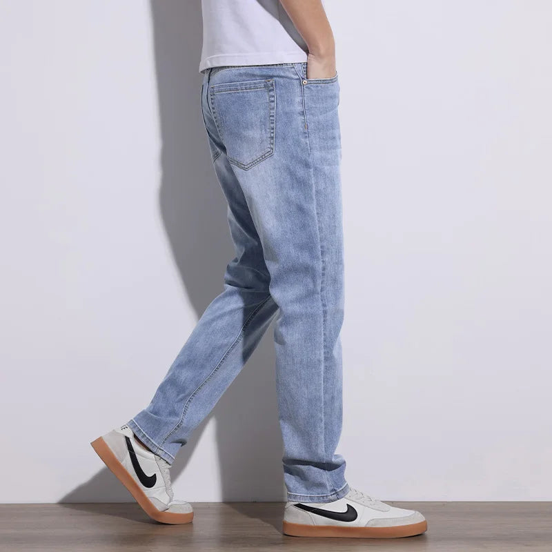 High-quality gray men's stretch denim jeans, offering core comfort and durable style for everyday outfits.