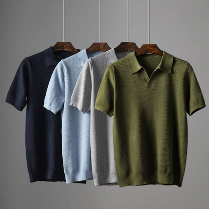 Men's blue waffle knit polo shirt, modern tailored fit, showing breathable fabric texture.
