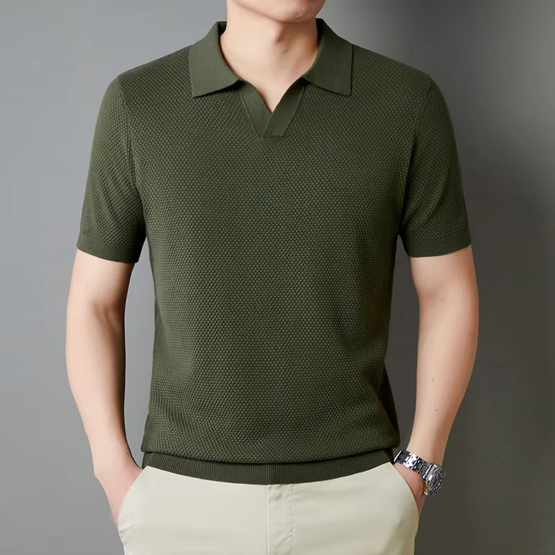 Model in a modern fit men's waffle knit polo shirt, showcasing comfortable stretch fabric.