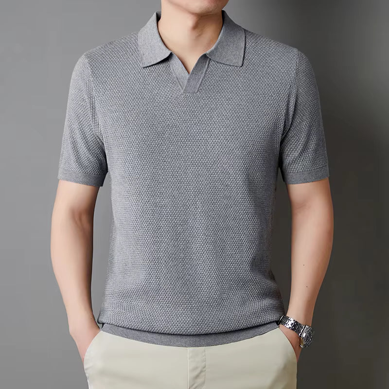 Men's casual black waffle knit polo, tailored fit, perfect for modern style.