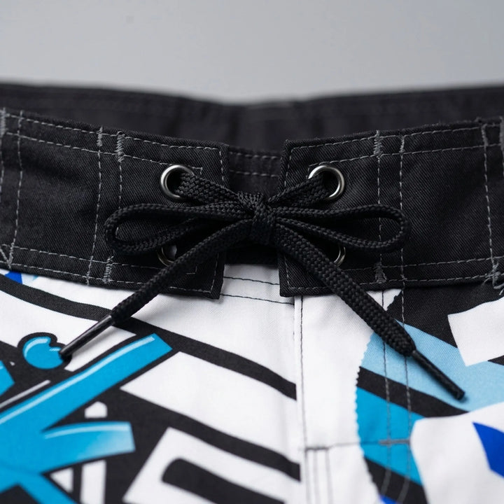 Men's quick-dry boardshorts with a bold geometric print, perfect for active swimming & beach.