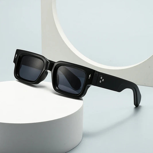Men's bold square sunglasses with chunky frame & UV protection. Modern fashion accessory.