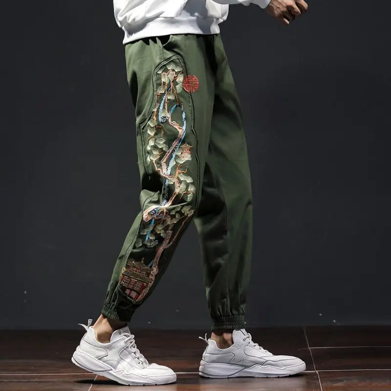 Comfortable men's sage joggers with intricate Bonsai embroidery. Relaxed fit, ideal for casual urban fashion.