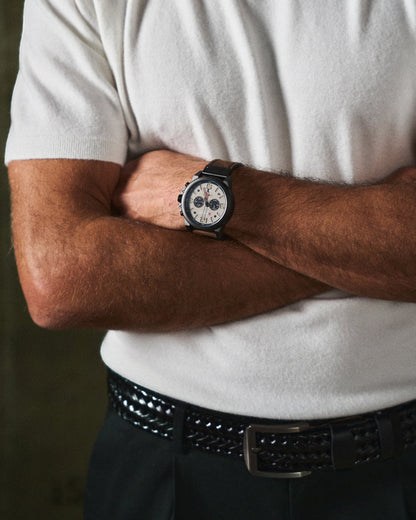 Sleek silver buckle on a men's braided cowhide leather belt, a refined detail for sophisticated men's fashion.