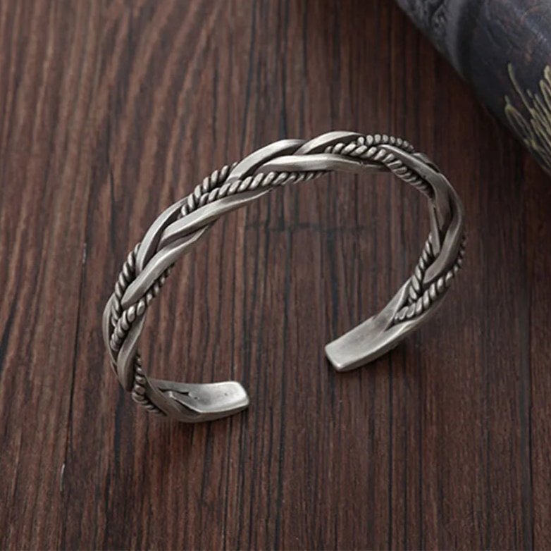Oxidized sterling silver braided men's cuff bracelet. Versatile men's jewelry, suitable for everyday and formal.