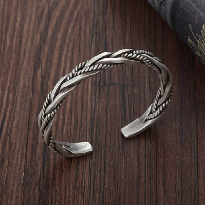 Oxidized sterling silver braided men's cuff bracelet. Versatile men's jewelry, suitable for everyday and formal.