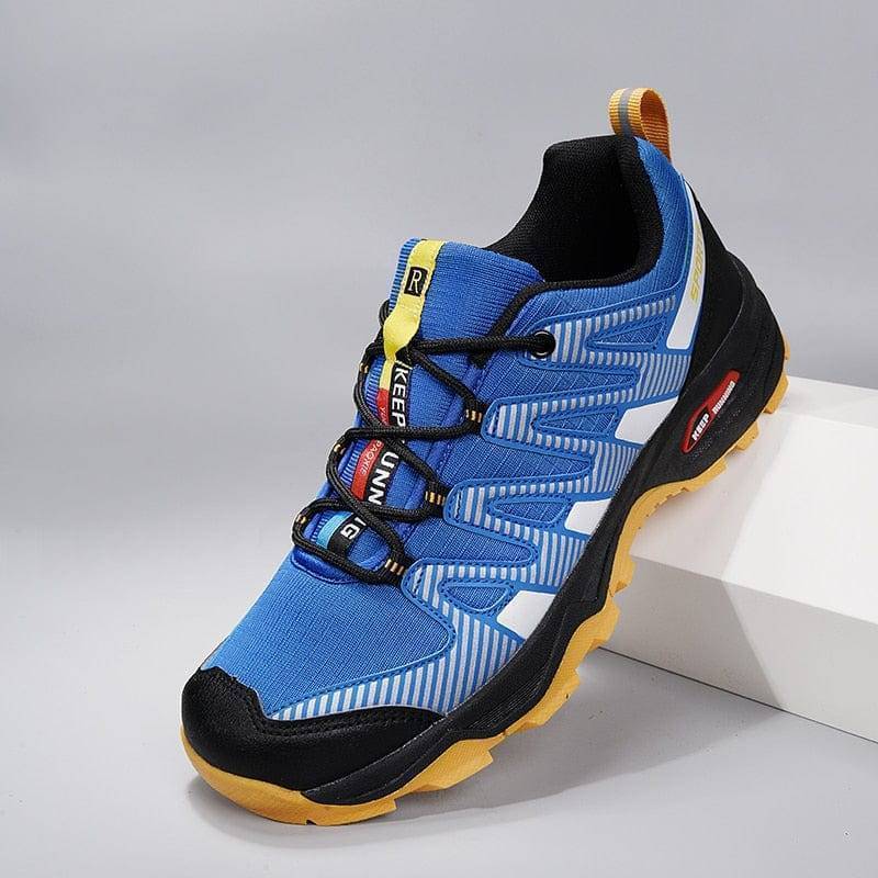 Men's breathable hiking shoes, grey & orange, for trekking & outdoor exploration.