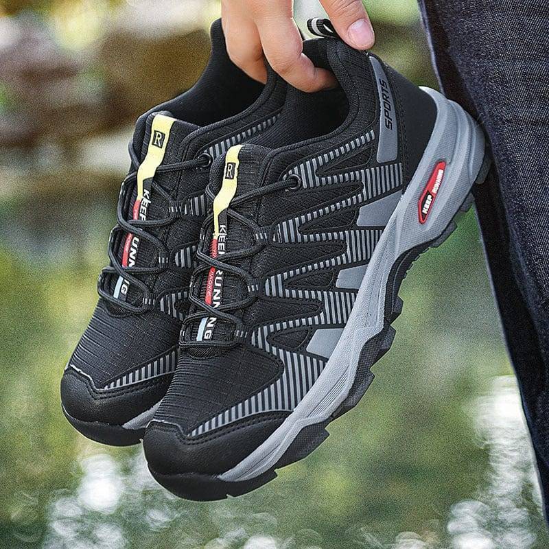 Pair of men's trekking shoes, breathable material, ideal for climbing & outdoor wear.