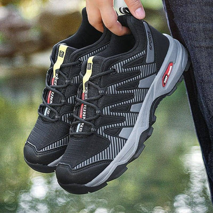 Pair of men's trekking shoes, breathable material, ideal for climbing & outdoor wear.