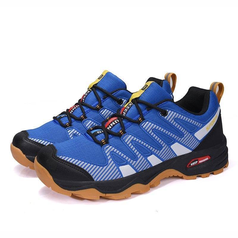 Side view of men's trekking shoes, emphasizing breathable design and supportive sole.