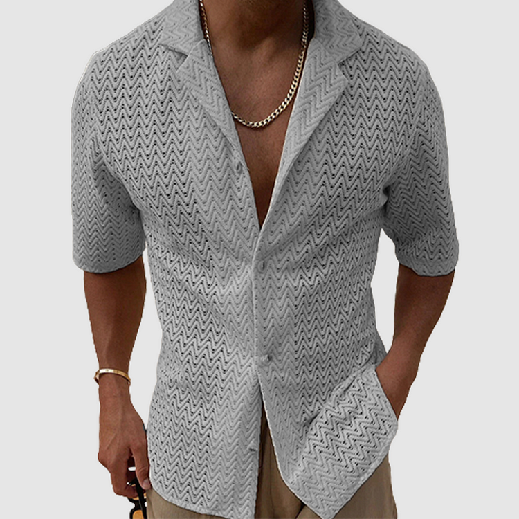 Men's short sleeve breathable shirt. Open-weave, relaxed fit, button-down for stylish warm weather casual wear.