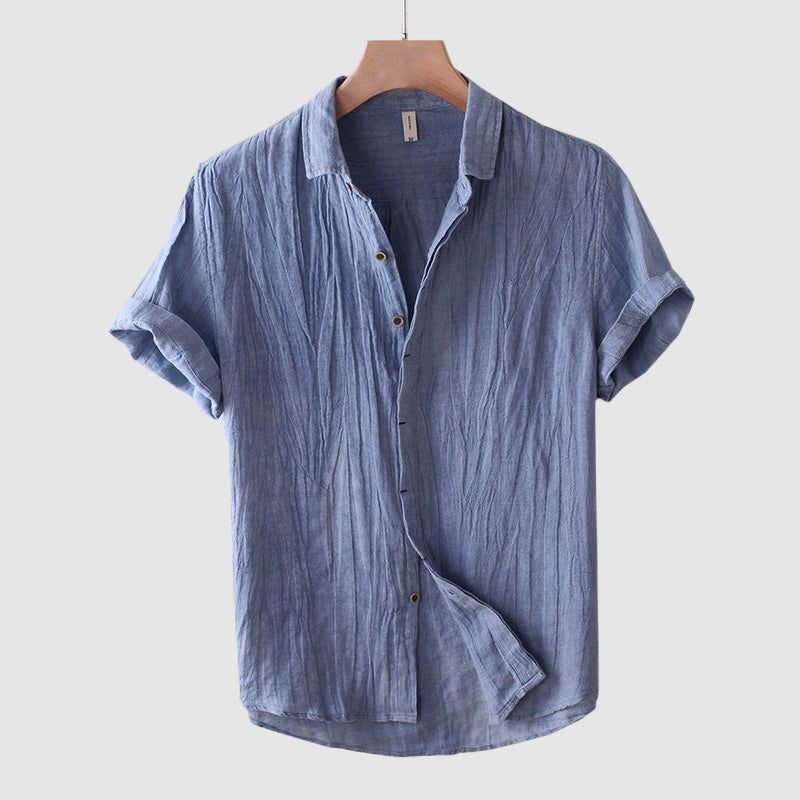 Men's breezy short sleeve shirt in relaxed fit, perfect for casual summer style. Effortless button-up top.