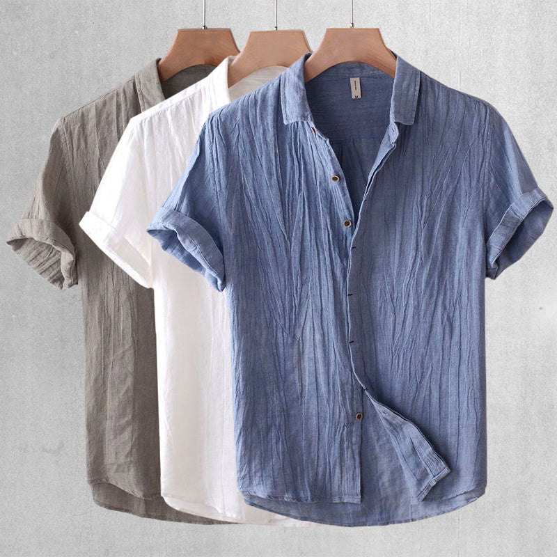 Lightweight men's breezy short sleeve shirt. Relaxed fit button-up top, perfect for casual summer wear.