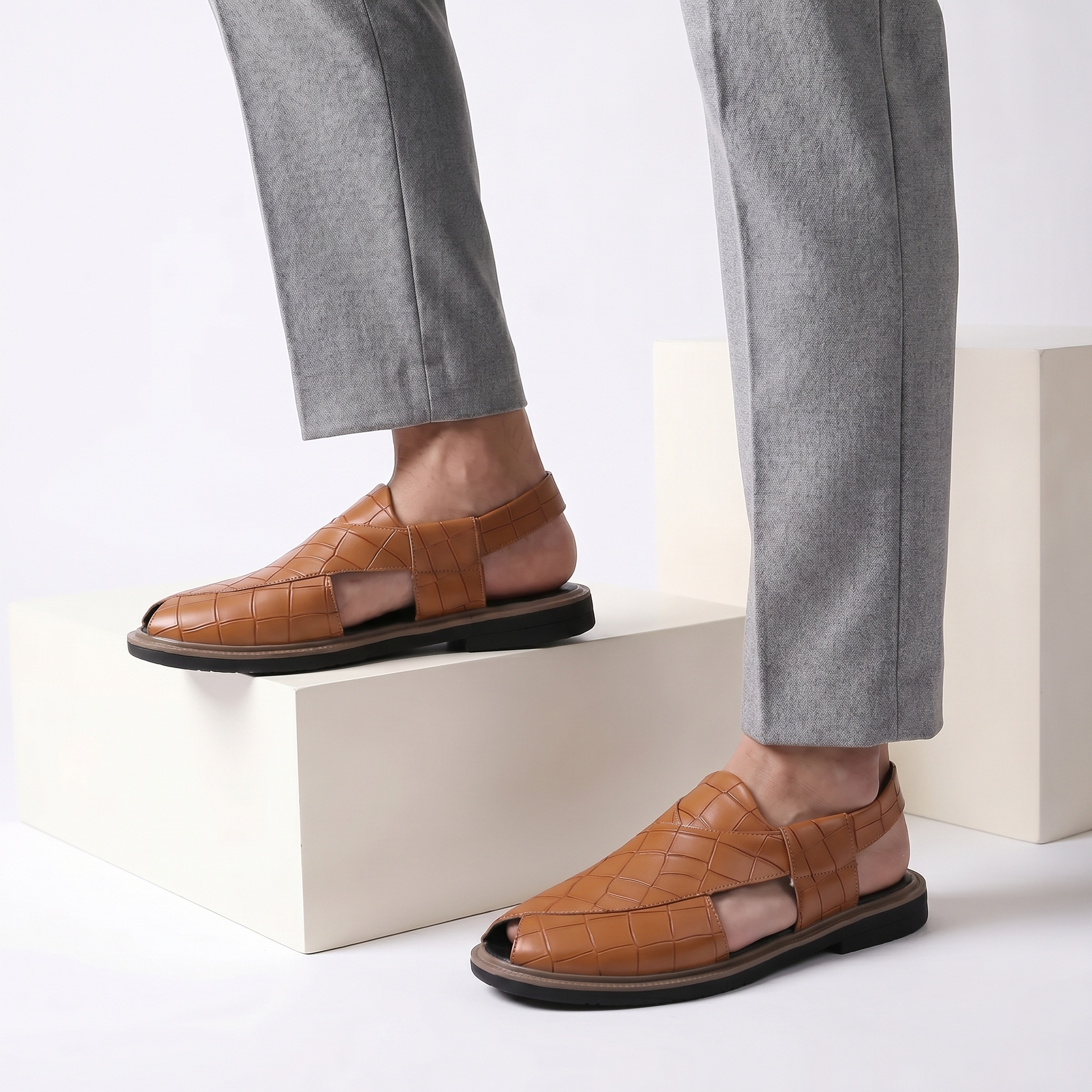 Close-up of men's Brenton durable outdoor sandals, highlighting grip soles & foot support.