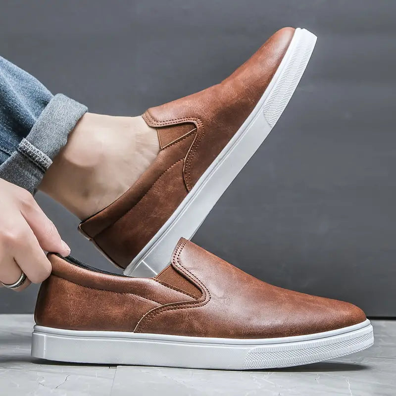Easy-to-wear black Brock slip-on loafers for men, combining modern style with everyday comfort and versatility.
