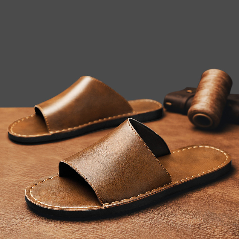 Black slip-on comfort sandals for men, perfect beach & vacation footwear.