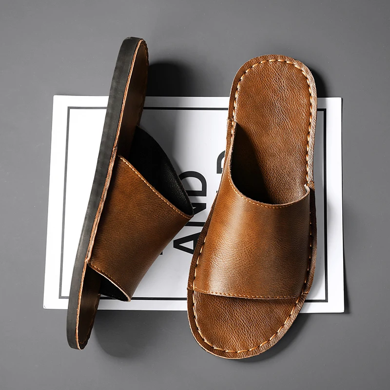 Men's black summer sandals with cross-straps, great for casual & beach outings.